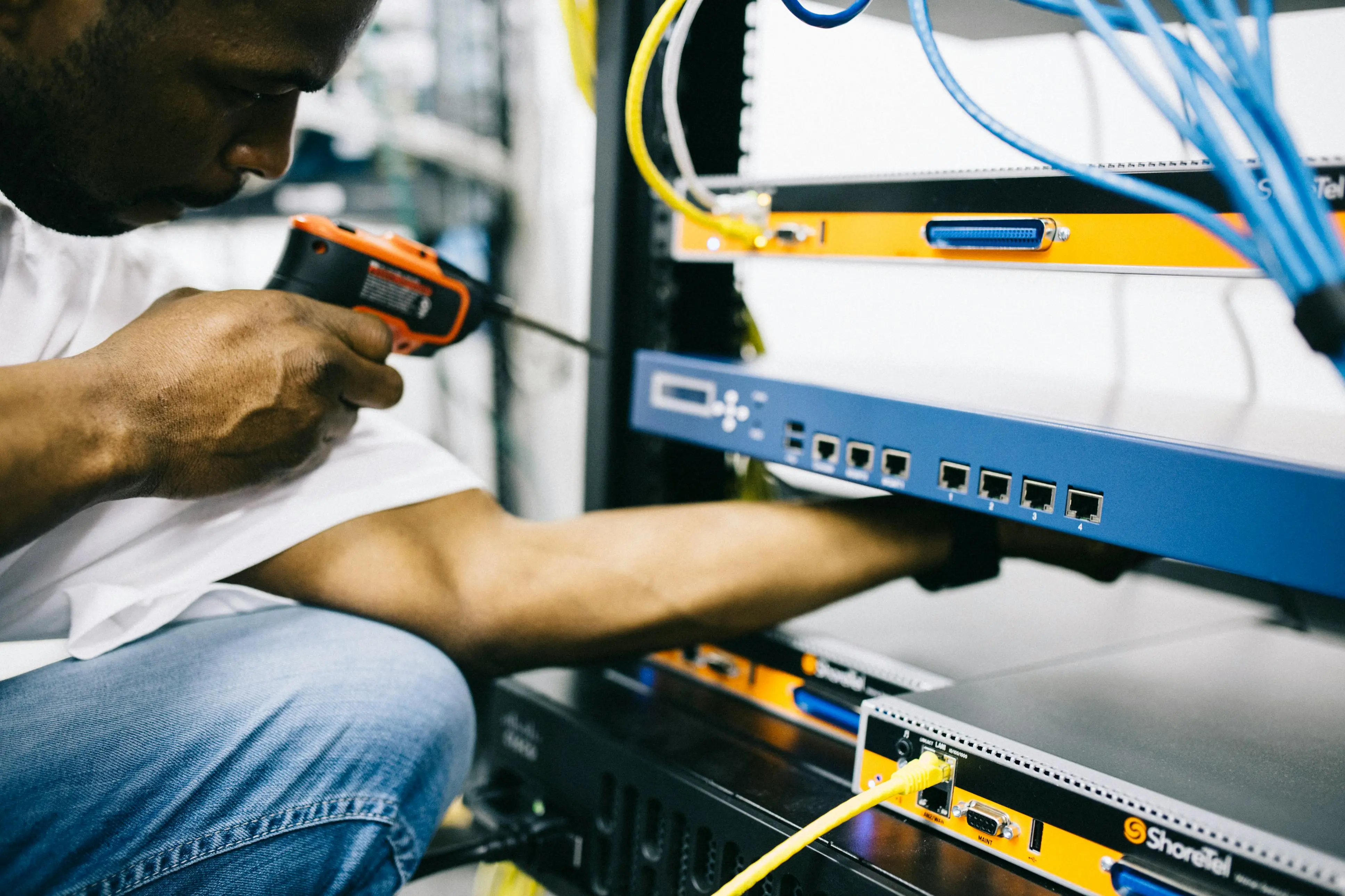 Picture of Engineer fixing a server rack
